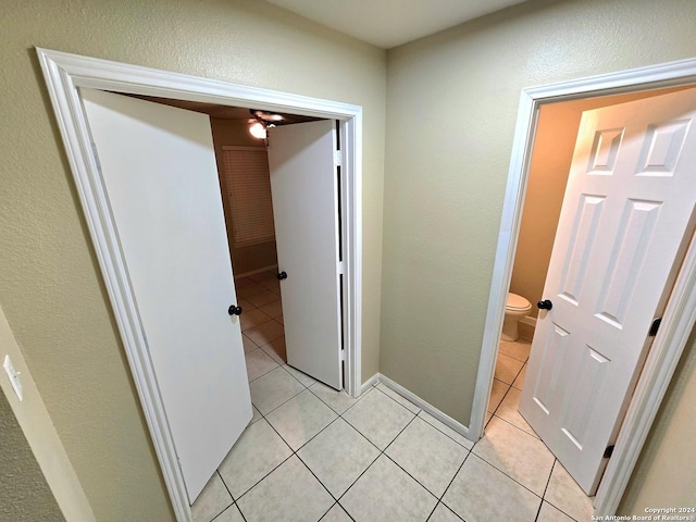 hallway featuring light tile patterned floors