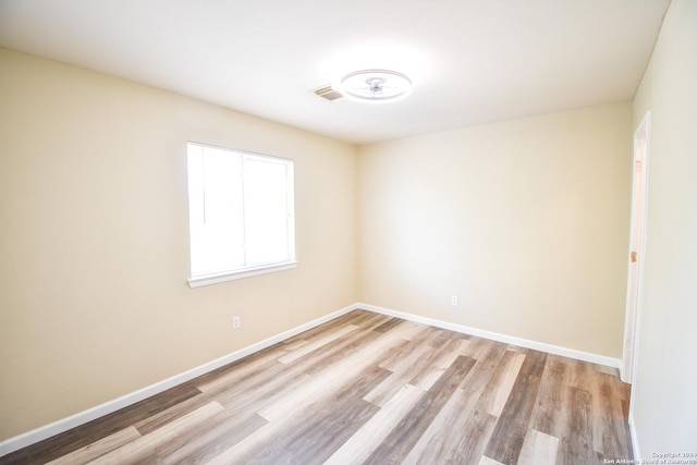 unfurnished room featuring light wood-type flooring