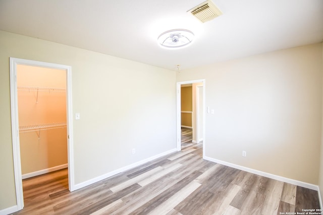 spare room with light wood-type flooring