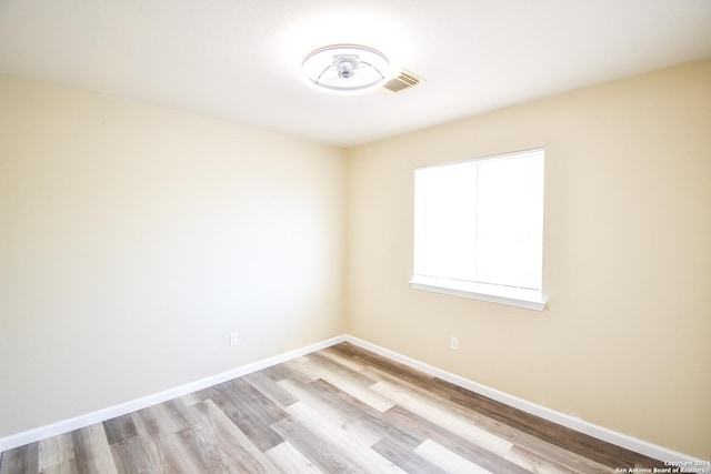 empty room with light wood-type flooring