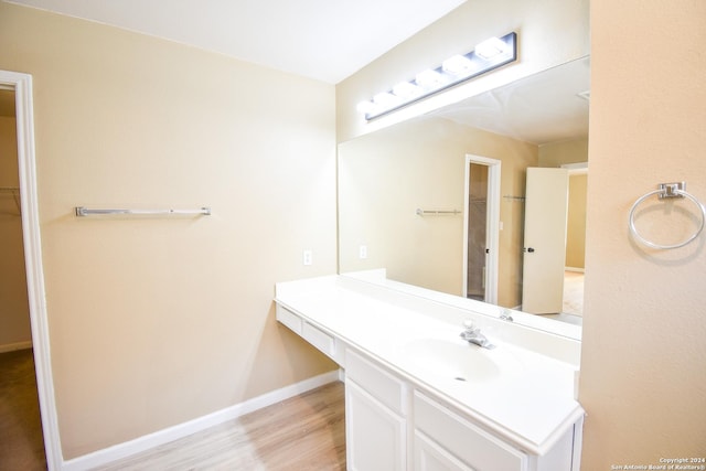 bathroom featuring hardwood / wood-style floors and vanity