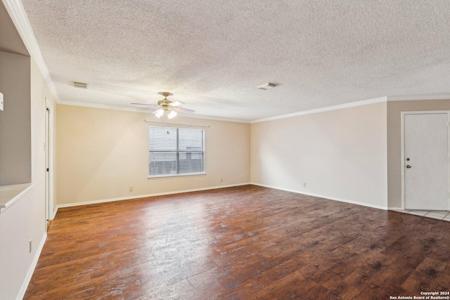 empty room featuring ceiling fan, dark hardwood / wood-style flooring, and ornamental molding