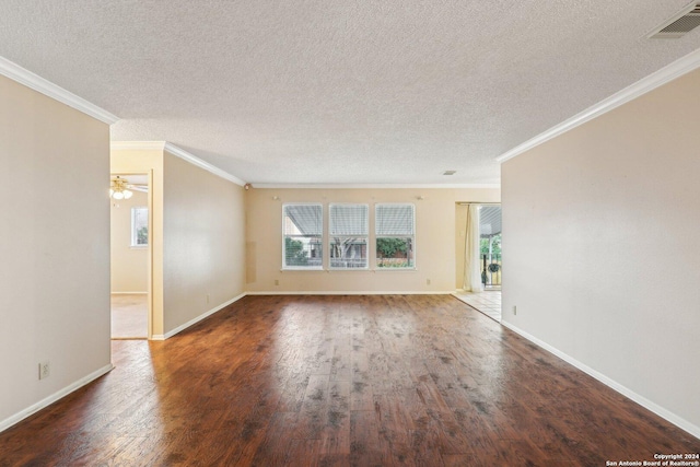 unfurnished room with dark wood-type flooring, plenty of natural light, and ornamental molding