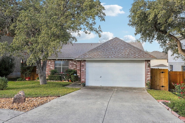 single story home with a garage and a front yard