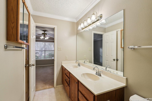 bathroom featuring vanity, a textured ceiling, ceiling fan, and crown molding