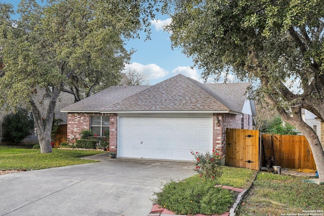 view of front of house featuring a front yard and a garage