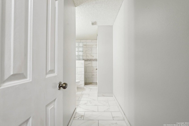 bathroom with a textured ceiling