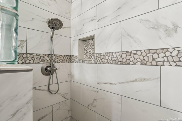 room details with a tile shower