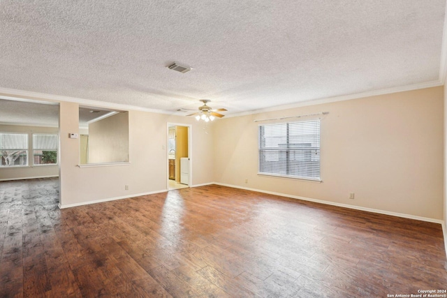 spare room with ceiling fan, dark hardwood / wood-style flooring, a textured ceiling, and ornamental molding