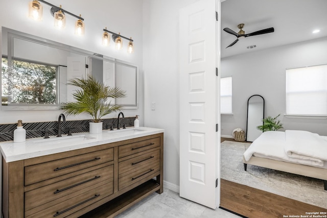 bathroom featuring ceiling fan and vanity