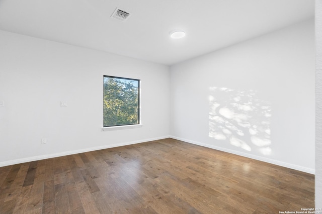 spare room with hardwood / wood-style flooring