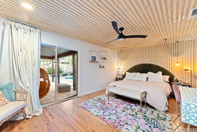 bedroom featuring access to exterior, ceiling fan, wooden ceiling, and hardwood / wood-style flooring