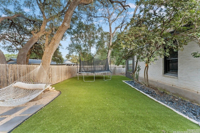 view of yard featuring a trampoline