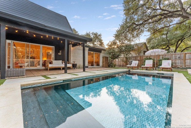 view of swimming pool with a patio area