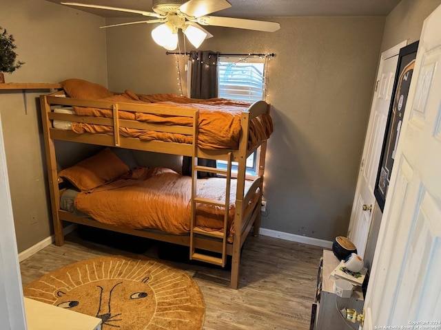 bedroom with ceiling fan and light wood-type flooring