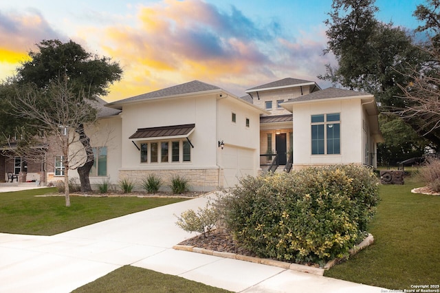 prairie-style home with a yard