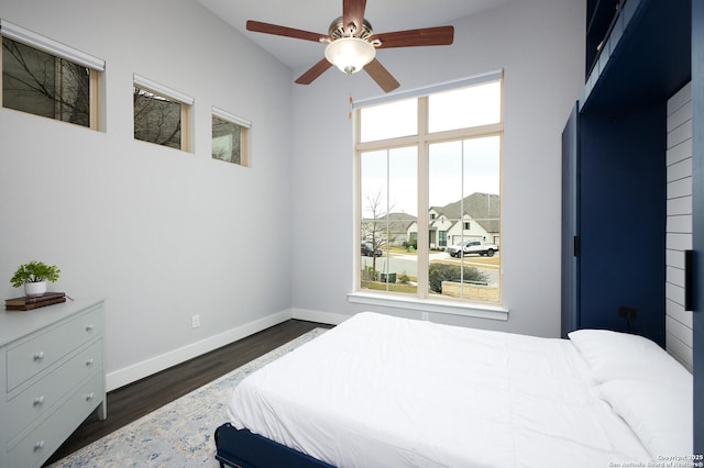 bedroom featuring ceiling fan and dark wood-type flooring