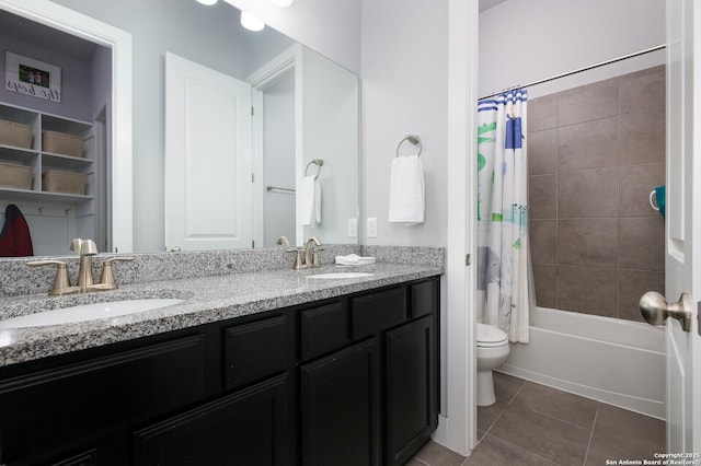 full bathroom featuring shower / bath combo with shower curtain, toilet, vanity, and tile patterned flooring