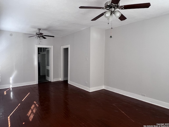 spare room featuring ceiling fan and dark hardwood / wood-style flooring