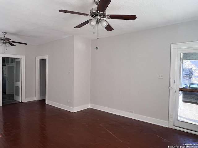 spare room featuring ceiling fan, dark hardwood / wood-style floors, and a textured ceiling