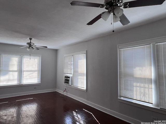 unfurnished room with dark hardwood / wood-style flooring, cooling unit, and ceiling fan