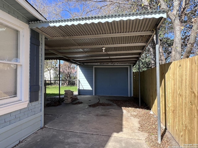 garage featuring a carport