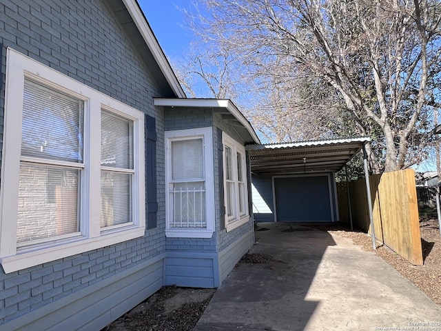 view of home's exterior with a carport