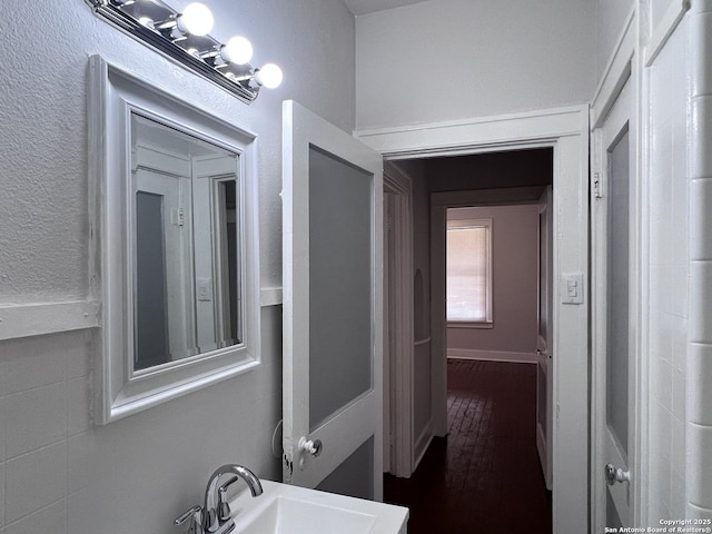 bathroom with sink and hardwood / wood-style flooring