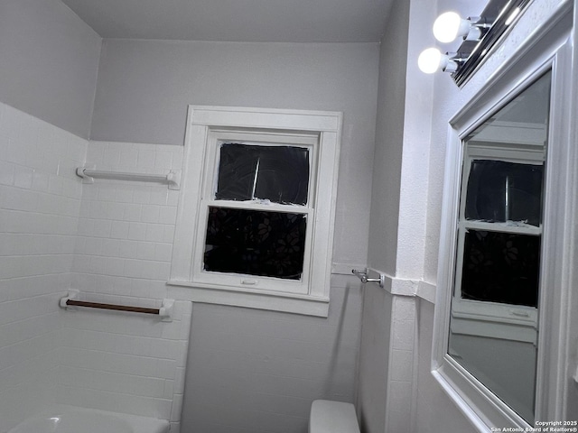 bathroom featuring a washtub