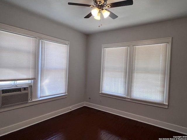 spare room with cooling unit, hardwood / wood-style floors, and ceiling fan