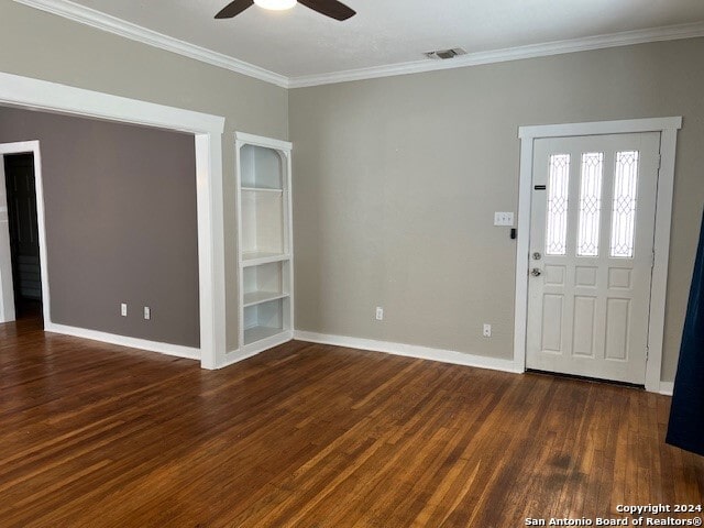 foyer entrance with ornamental molding, ceiling fan, and dark wood-type flooring