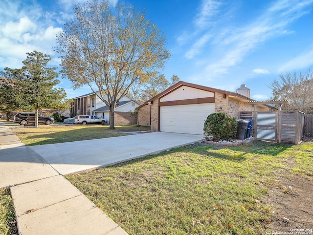 view of front of home with a garage and a front yard