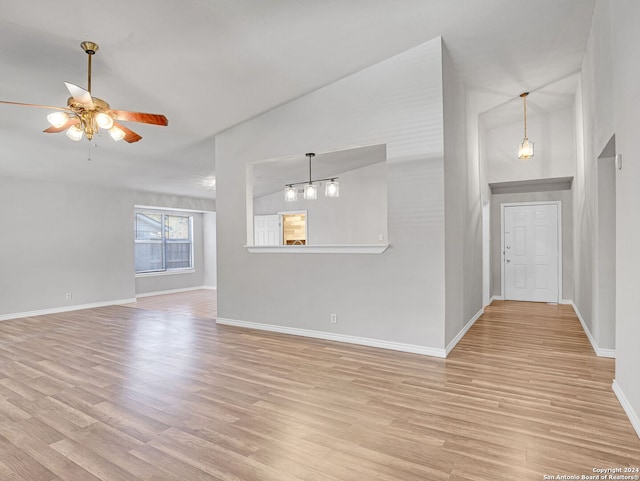 unfurnished living room with ceiling fan, light hardwood / wood-style floors, and high vaulted ceiling