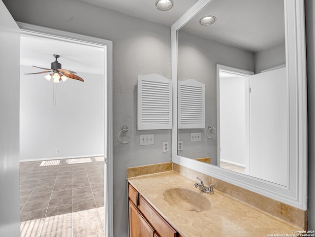 bathroom featuring tile patterned floors, vanity, and ceiling fan