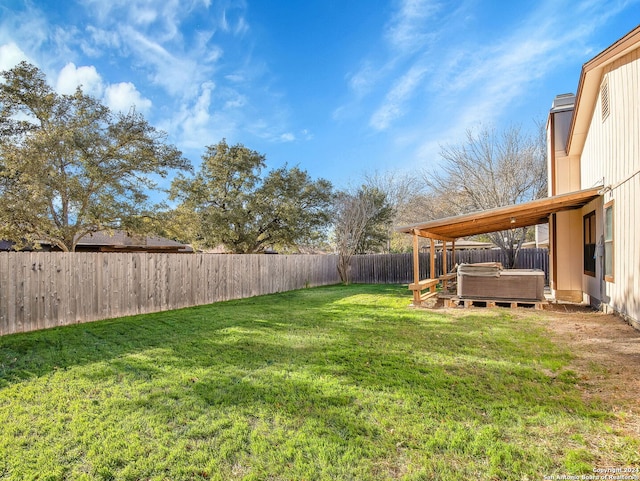 view of yard with a hot tub