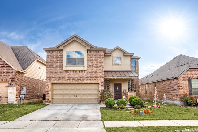 view of front of property featuring a garage and a front yard