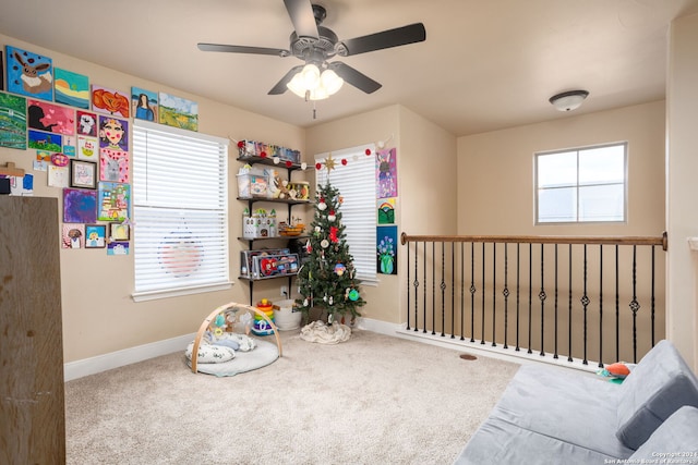 game room featuring carpet flooring, a wealth of natural light, and ceiling fan