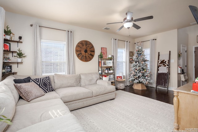 living room featuring hardwood / wood-style flooring and ceiling fan