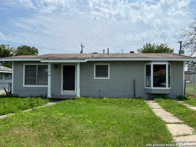 view of front of property with a front lawn