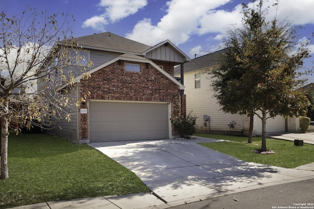 view of front of home featuring a front yard and a garage