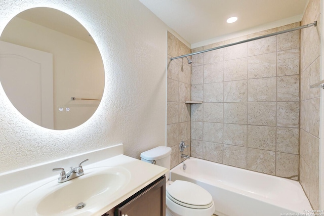 full bathroom with vanity, toilet, and tiled shower / bath