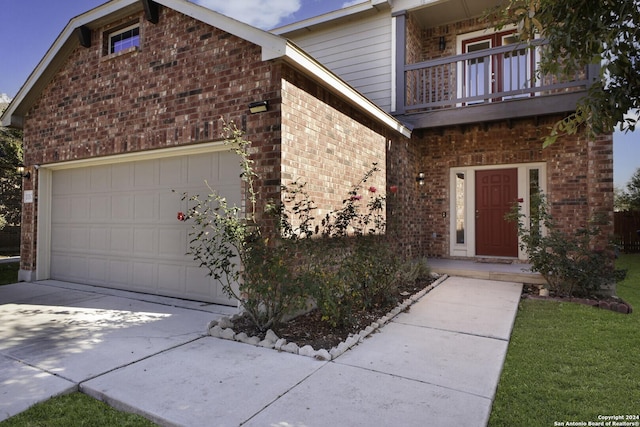 entrance to property with a balcony