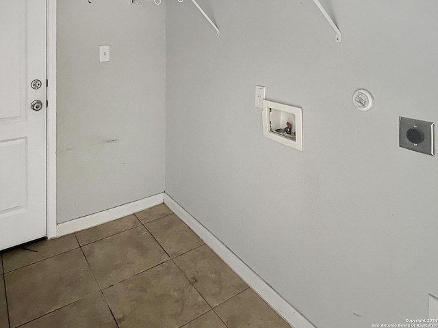 washroom with hookup for an electric dryer, tile patterned flooring, and hookup for a washing machine