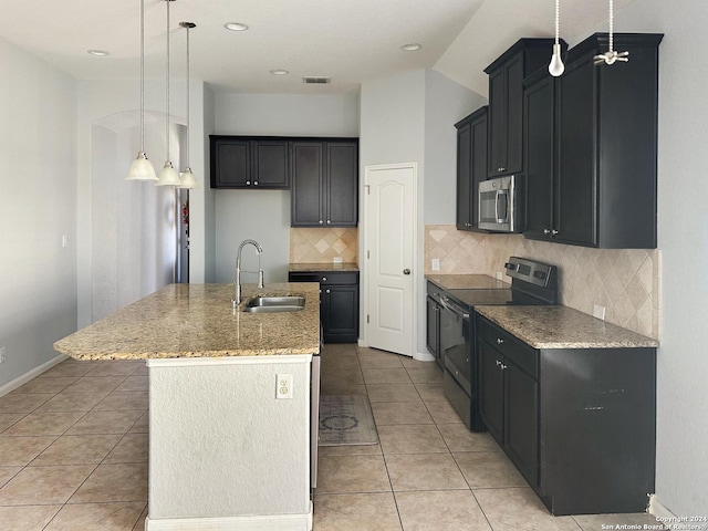 kitchen featuring a center island with sink, sink, black electric range, tasteful backsplash, and light tile patterned flooring