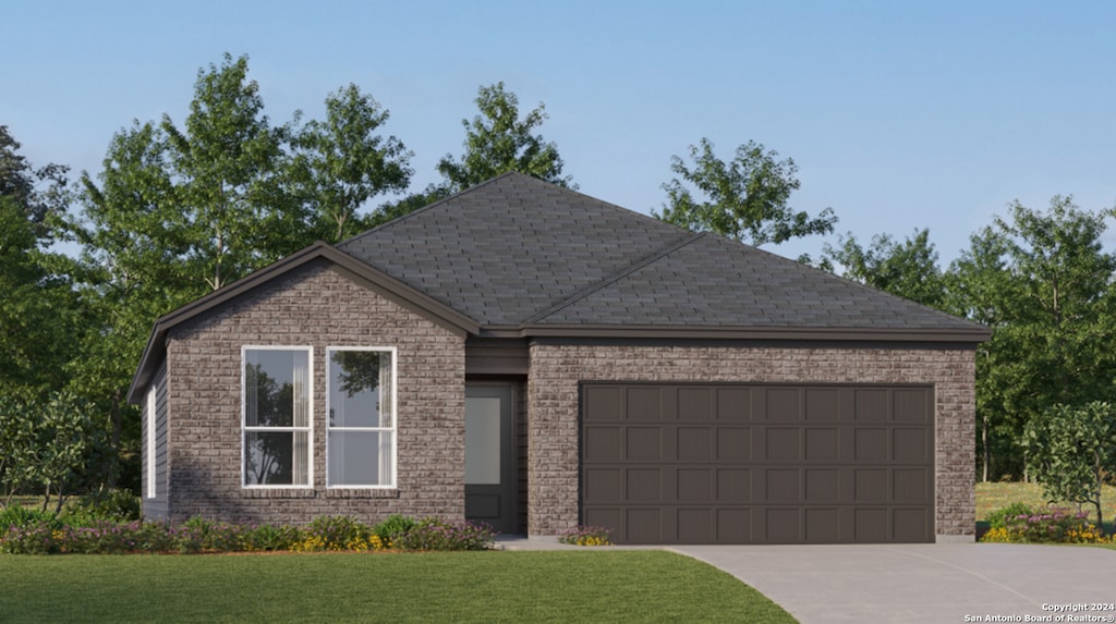 view of front of property featuring a front lawn and a garage