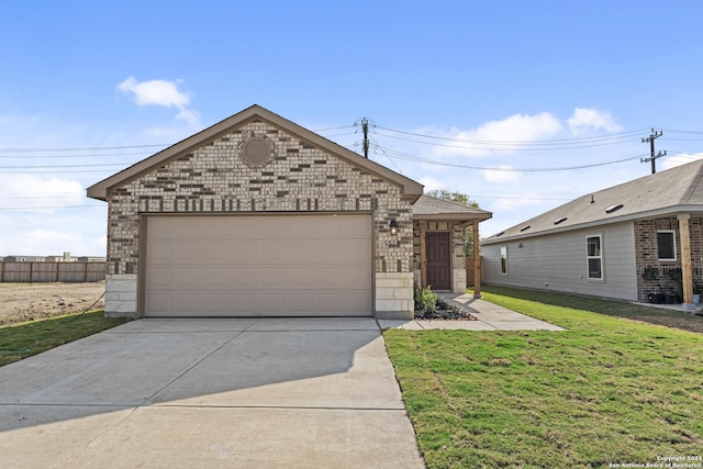 view of front facade featuring a garage and a front lawn