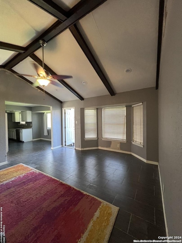 unfurnished living room featuring lofted ceiling with beams and ceiling fan