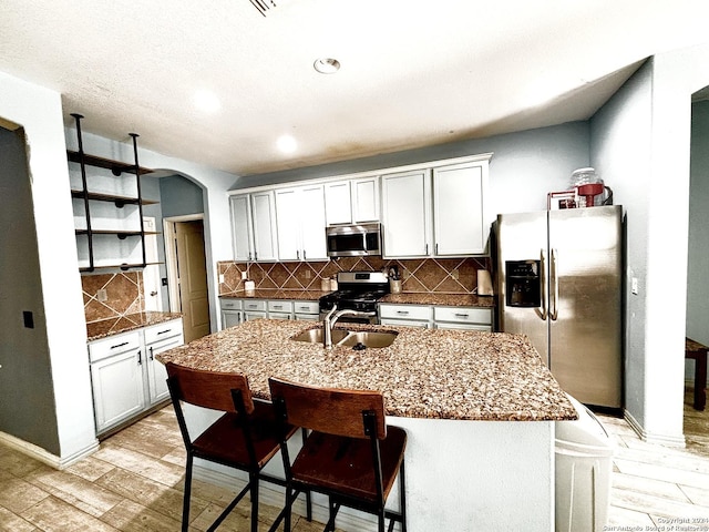 kitchen with white cabinetry, sink, and appliances with stainless steel finishes