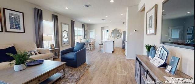 living room with light hardwood / wood-style flooring