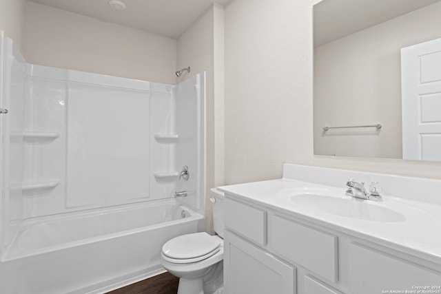 full bathroom with shower / washtub combination, hardwood / wood-style floors, vanity, and toilet
